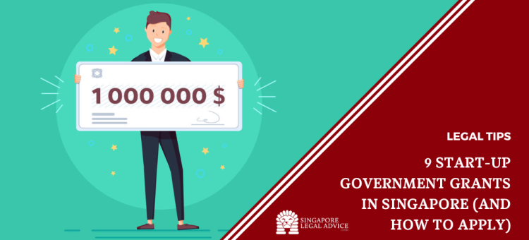 Man holding business grant cheque
